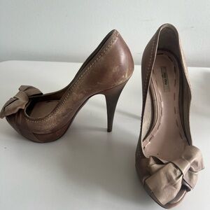 Miu Miu distressed leather tan pumps with bow
